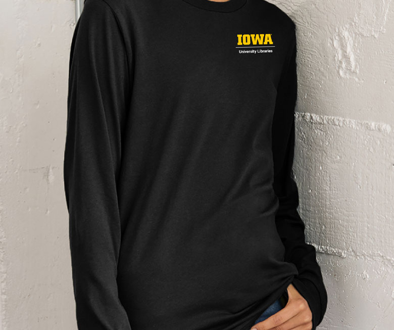 Unit lockups displayed on a shirt set against a wall.